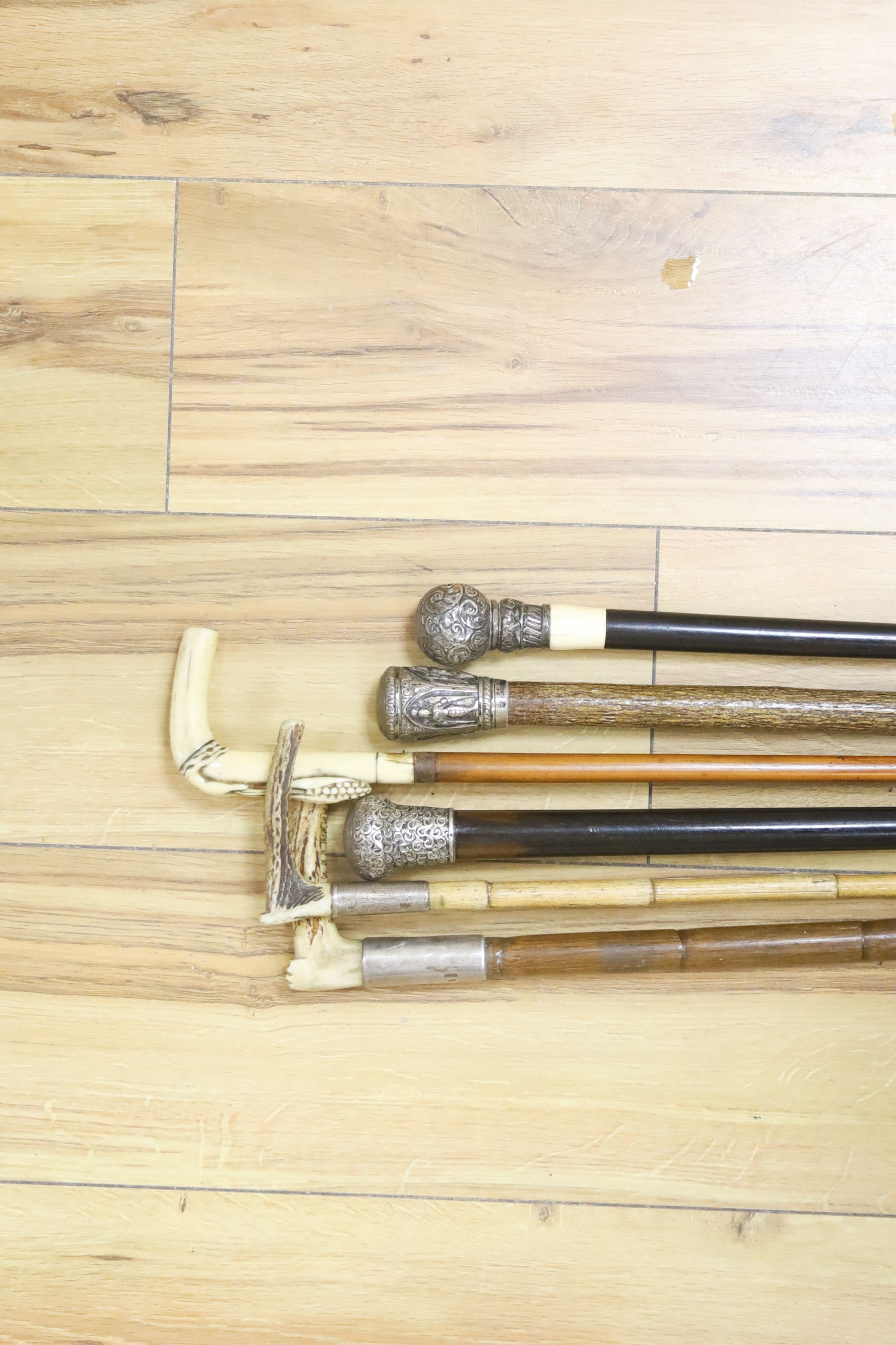 A silver-topped horn and ivory handled walking sticks (6)